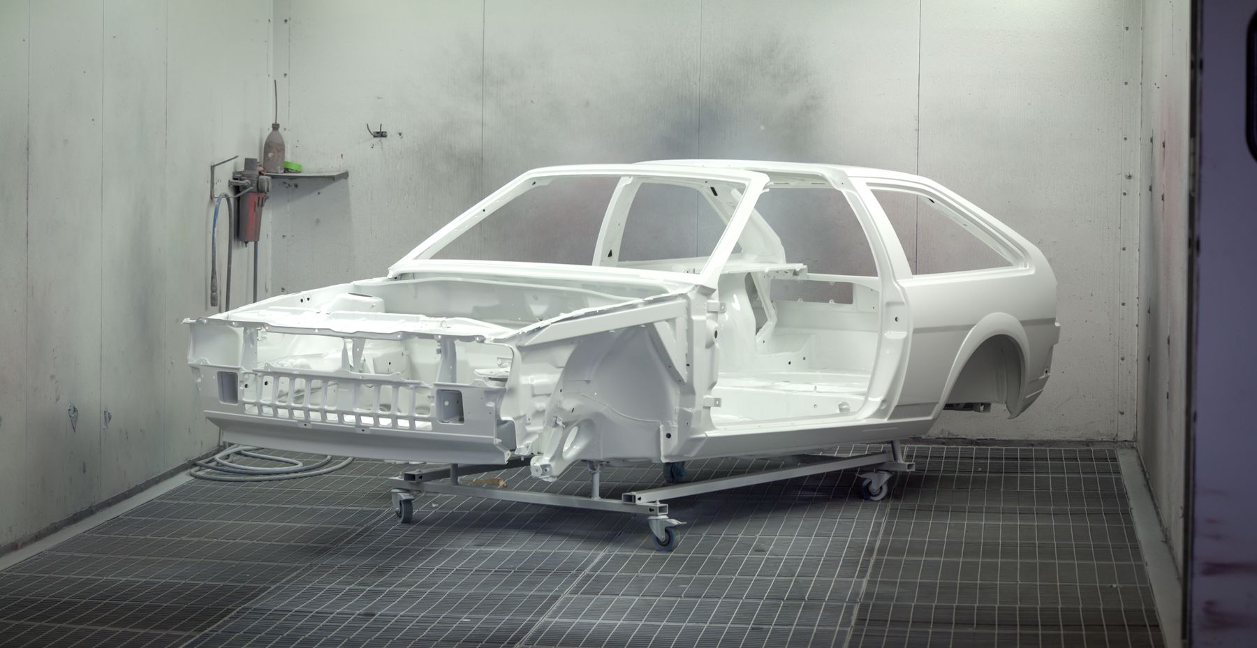 Car body shell inside a paint booth