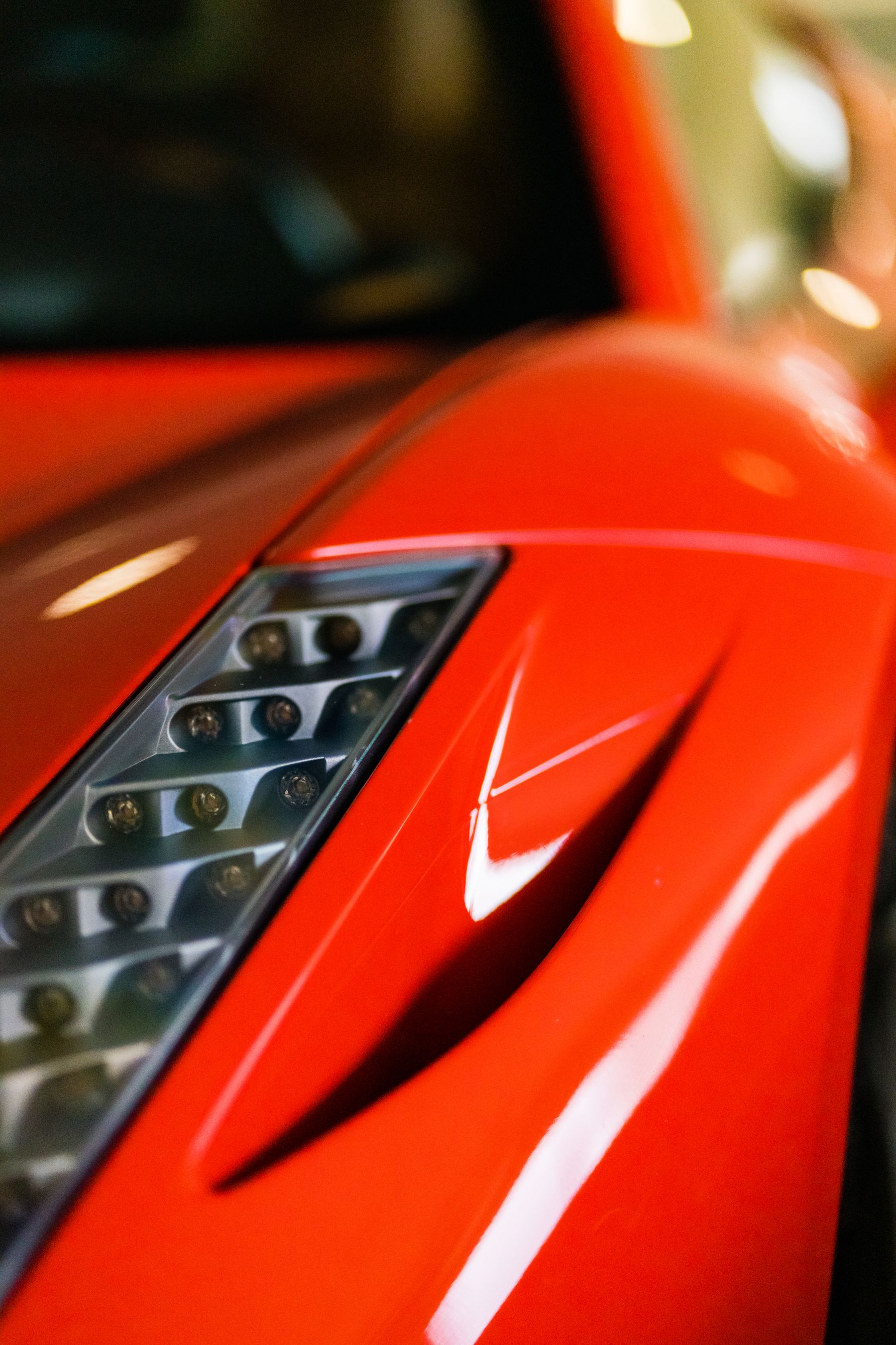 Close-up of a red sports car's front